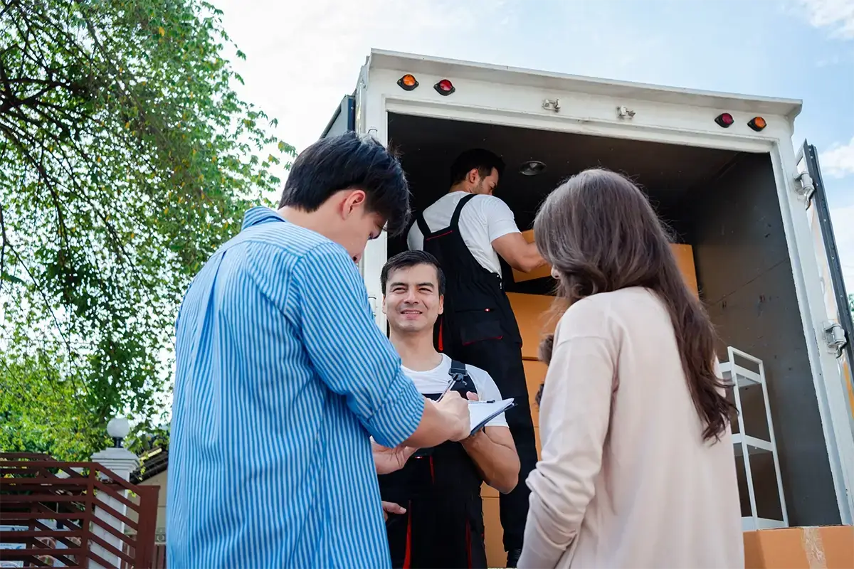 asian-couple-check-while-unloading-boxes-and-furni