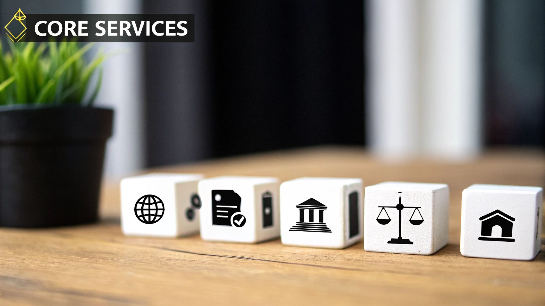 White cubes displaying icons for global, document, legal, justice, and property services on wood.